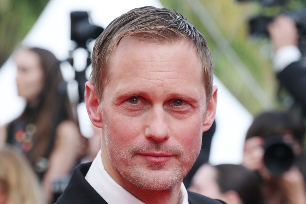 Alexander Skarsgard "threw a towel" and "crushed" him after early fame, at the age of 13, about his acting career.