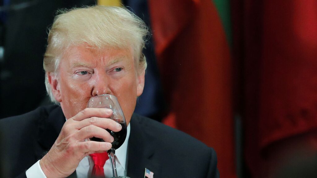 Donald Trump sips Diet Coke from a wine glass after a toast during a luncheon for world leaders at the United Nations in 2018. Pic: Reuters