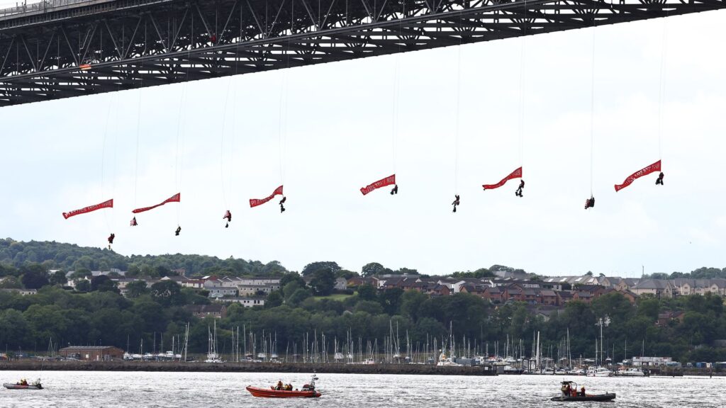 Ten Greenpeace activists were arrested after halting from the bridge